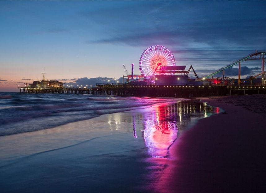 The Santa Monica Pier ferris wheel lit up at night