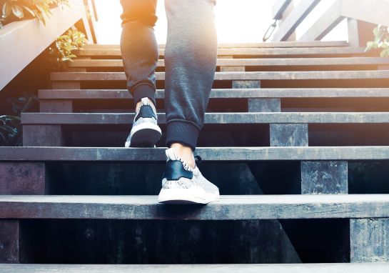 A person running outdoor stairs in Santa Monica