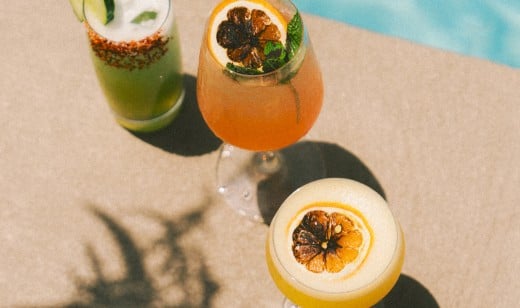 Three cocktails in the sun by the pool