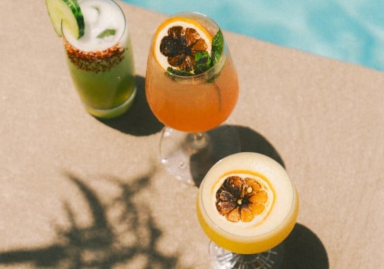 Three cocktails in the sun by the pool