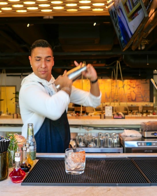 Bartender mixing foxtail cocktails at the bar